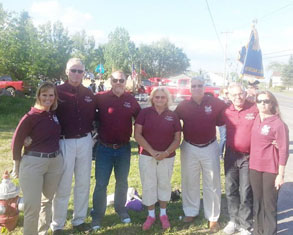 group of people dressed in red shirts