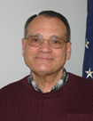 headshot of man with glasses