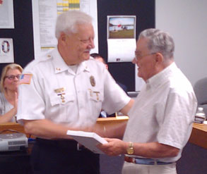 police chief shakes hands with mayor