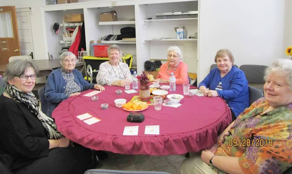 group of senior citizens at a table