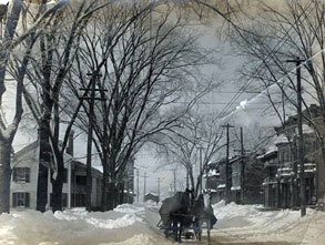 horse drawn sleigh moves through snow