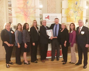 group of people with an award