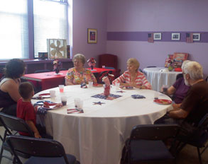 table full of senior citizens talking
