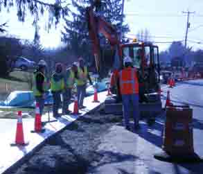 construction crews lay sidewalk concrete