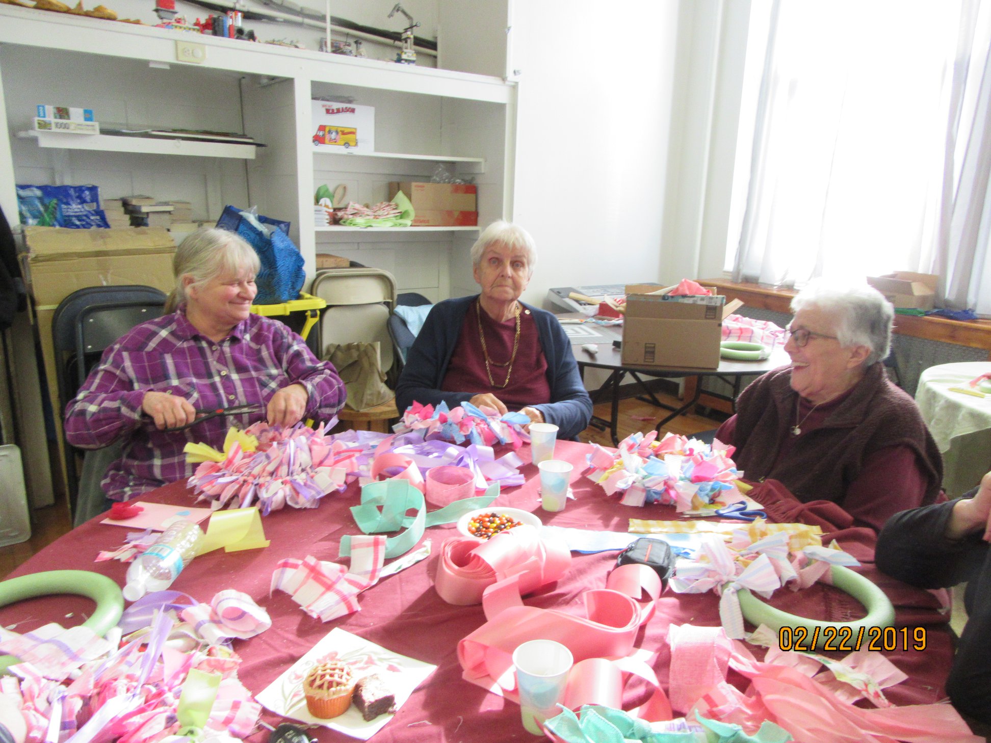 three women at a table with spring decorations