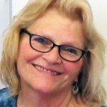 women with glasses smiling