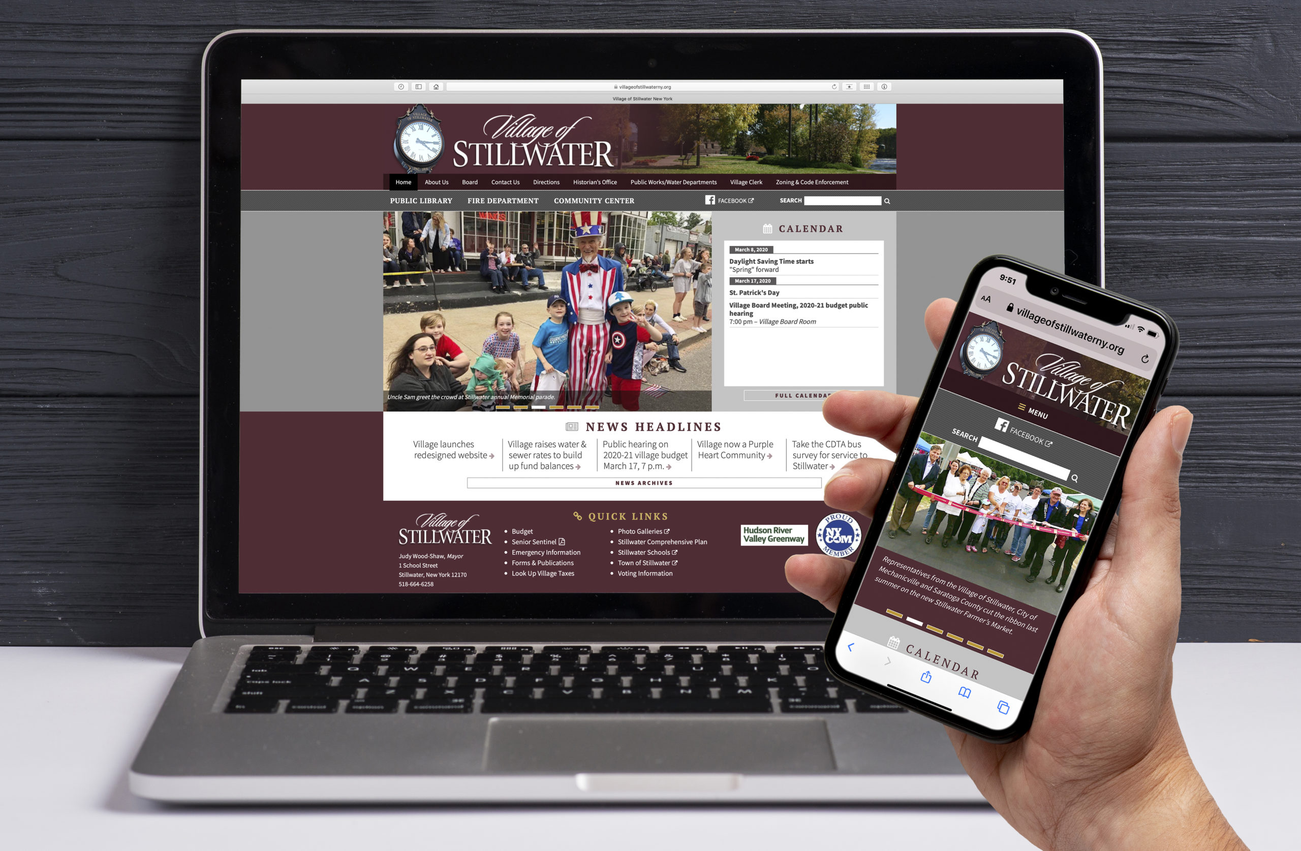 picture of website homepage and hand holding a cell phone