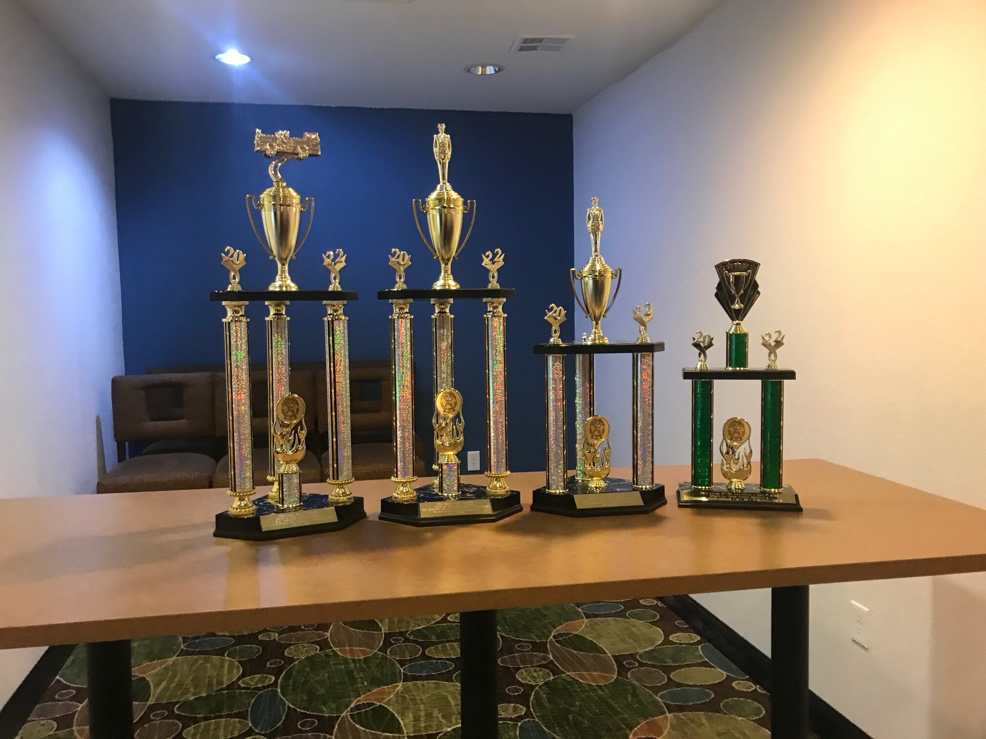 4 trophies on a table