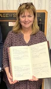 Woman holds oath book